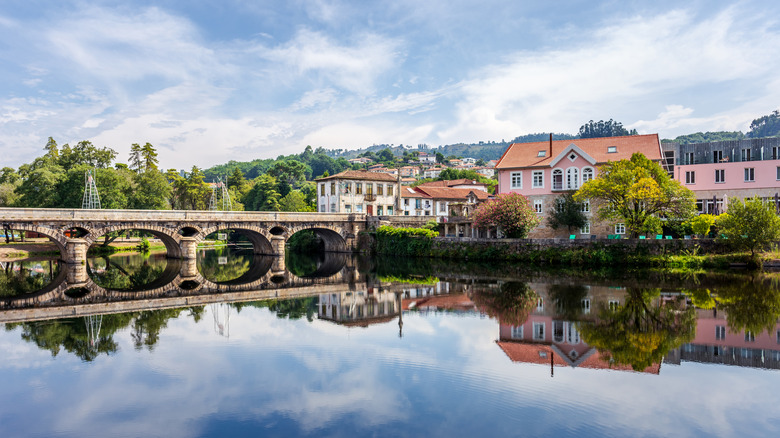 Arcos de Valdevez , Portugal; October 2020 with view of the old stone bridge over the river Vez in the town of Arcos de Valdevez.