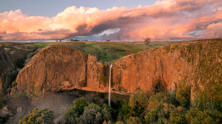 Tall waterfall plunging over cliff