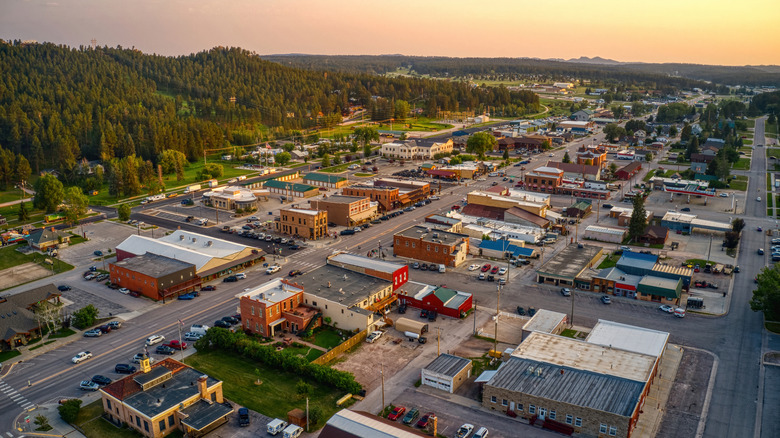 Small-town buildings and main street in Custer at sunset