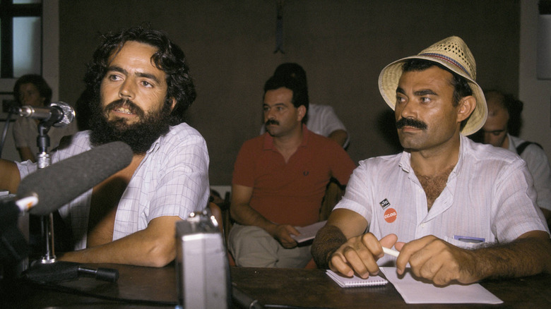Marinaleda mayor, Juan Manuel Sánchez Gordillo speaking into a microphone