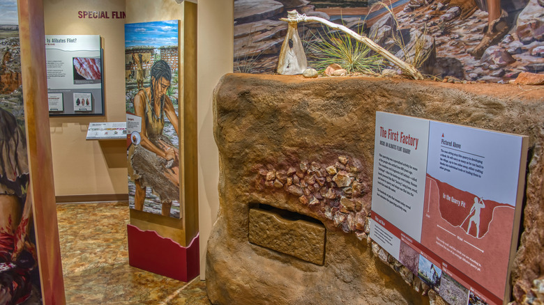 Museum exhibit with signage and rock decorations