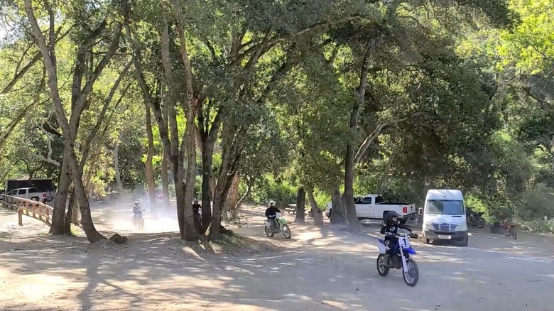 Dirt bikes riding through the campground at Hollister Hills SVRA