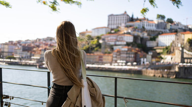 Woman overlooking the Douro River in Porto