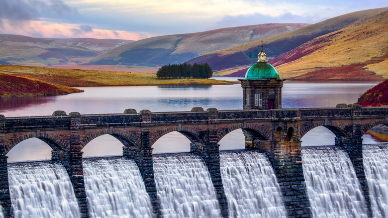 Water flowing from a reservoir down a dam