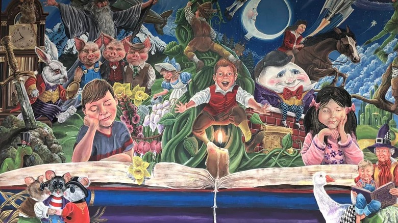 Mural painted by Steve Ferchaud at the Paradise, California library with children and storybook characters depicted