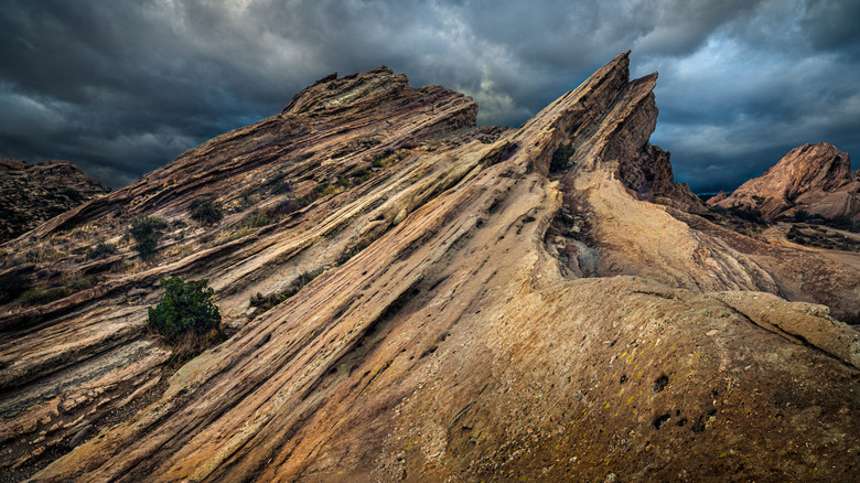 Vasquez Rock formation against stormy sky