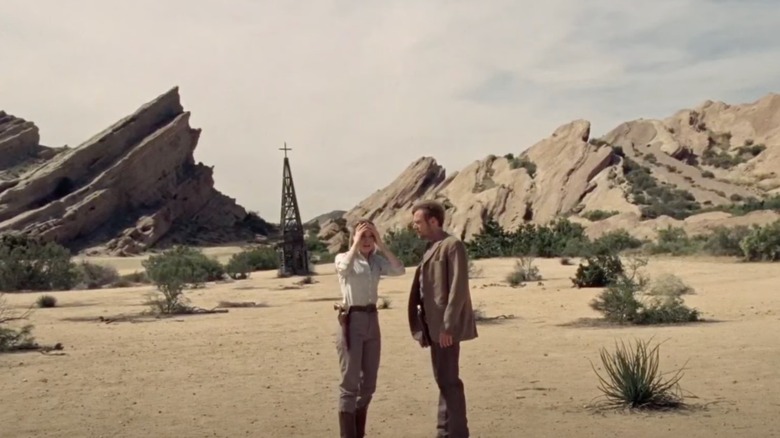 Evan Rachel Wood holds head in hands next to Jimmi Simpson Vasquez Rocks