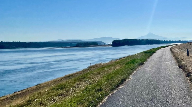 A path going through Blue Lake Regional Park next to Blue Lake in Oregon