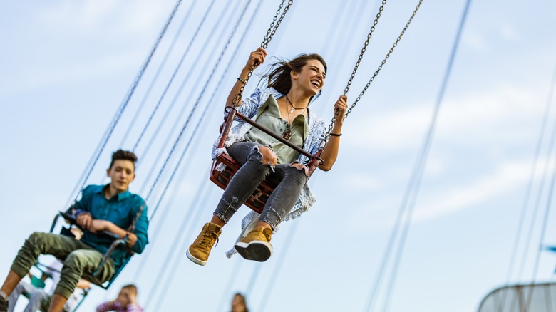 Riders on flying swings
