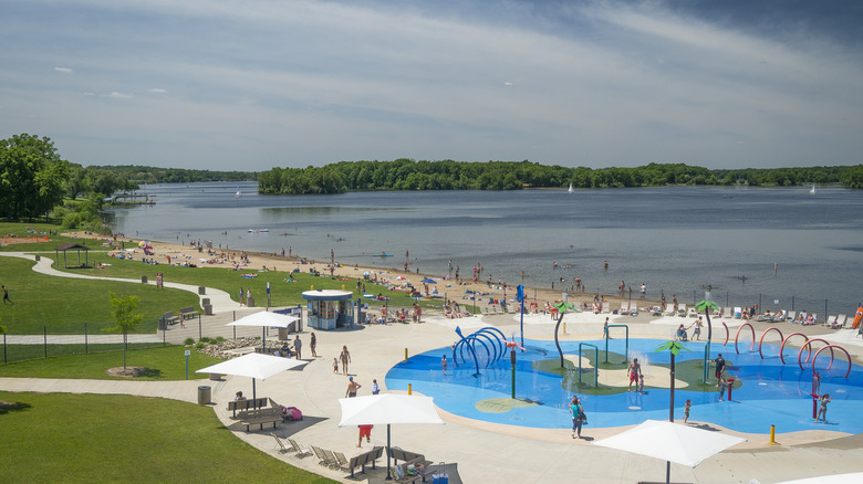 A view of a lakeside beach and water park