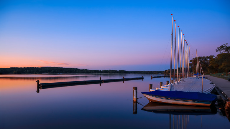 A scenic view of boats in a port at twilight at Kensington Metropark