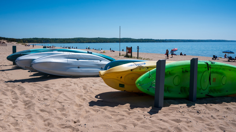 Kayaks lined up on the beach at Petoskey State Park on Lake Michigan