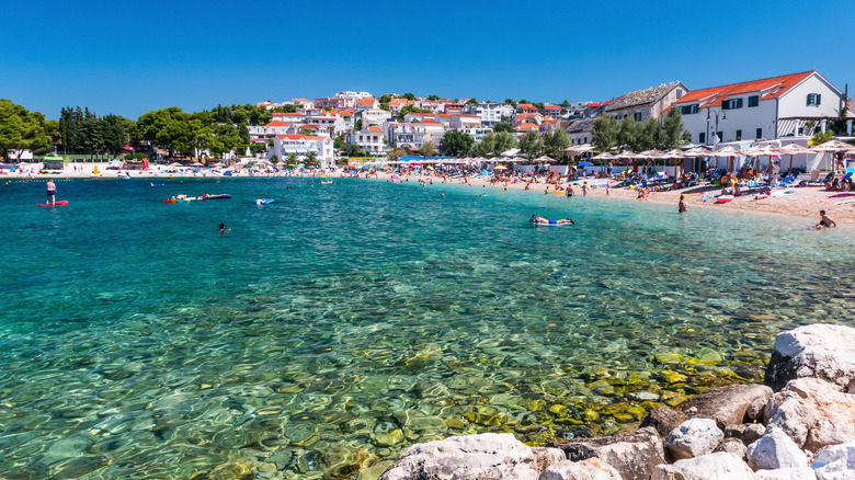 People enjoying Primosten beach in Sibenik Knin county