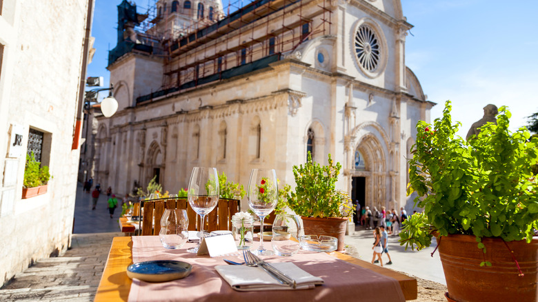 Restaurant table set with view of St James Cathedral