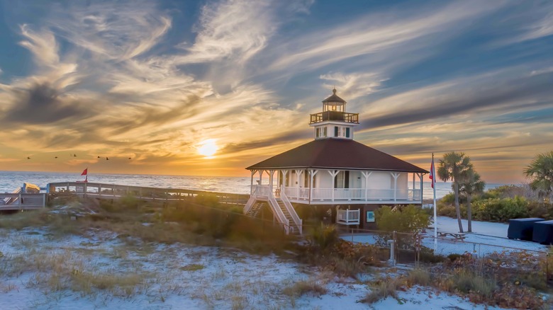 The Boca Grande Lighthouse against a golden sunset on Gasparilla Island