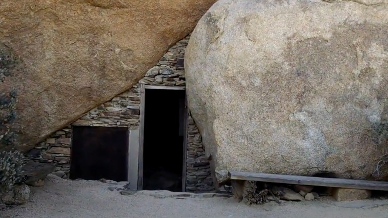 Doorway built between two boulders