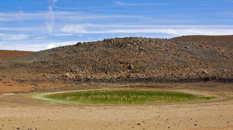 Green lake in volcanic landscape