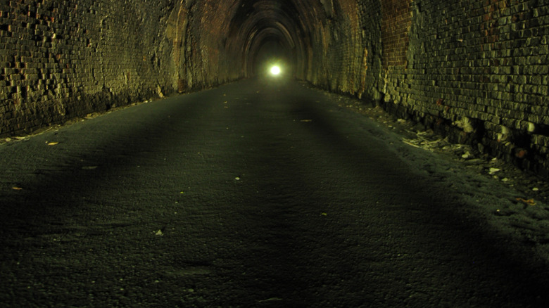 Inside Blue Ridge tunnel with a light at the end