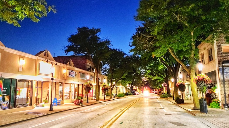 After dark street in downtown Homewood, Illinois with trees and sidewalks