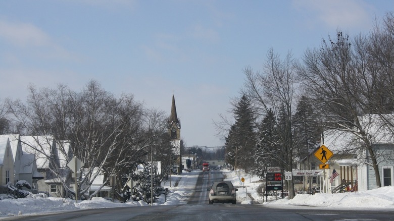 Downtown Horicon, Wisconsin, looking down a road toward a church steeple, on a wintery day with snow on the ground
