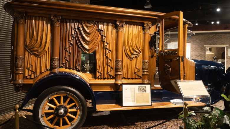 Antique hearse with carved wooden panels at the National Museum of Funeral History in Houston