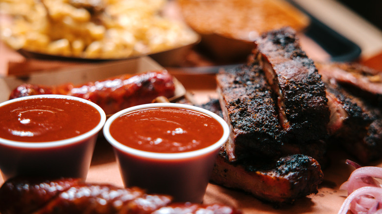 Close-up of a barbecue plate with ribs and sausage