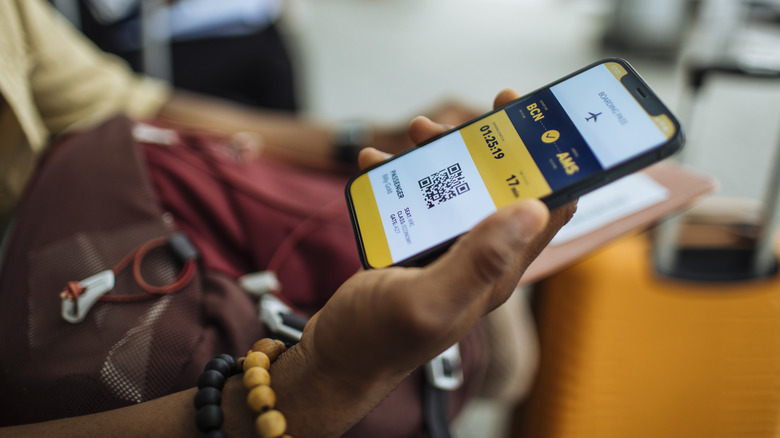 holding a digital boarding pass