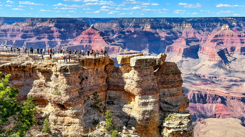 Tourists taking in the views of the Grand Canyon from Mather Point