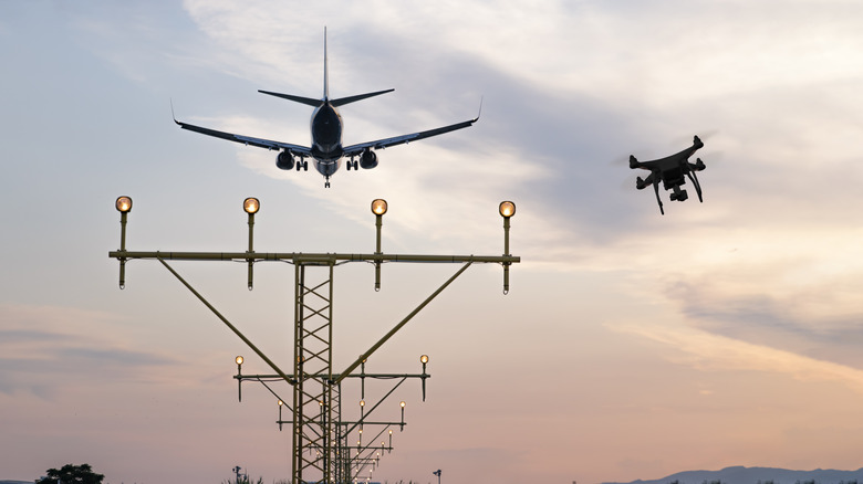 A drone flying behind an airplane