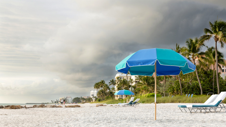 An empty Florida beach with grey skies indicating a storm is coming