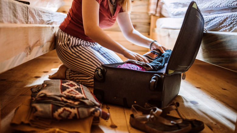 packing up suitcase for trip