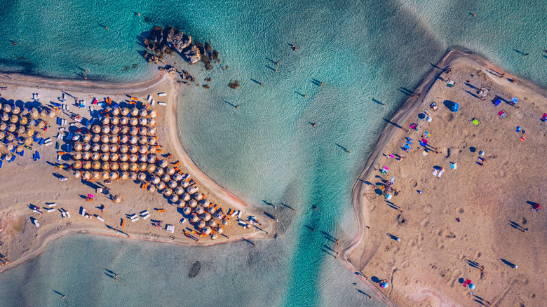 Aerial view of Elafonissi Beach, Crete, with sunbeds and turquoise water