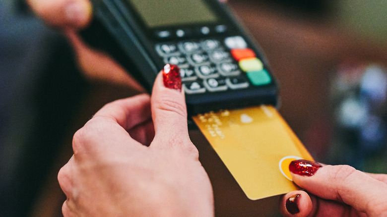 Person paying using their credit card
