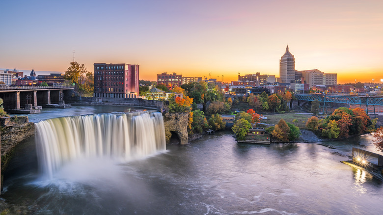 waterfall and skyline in Rochester at sunset