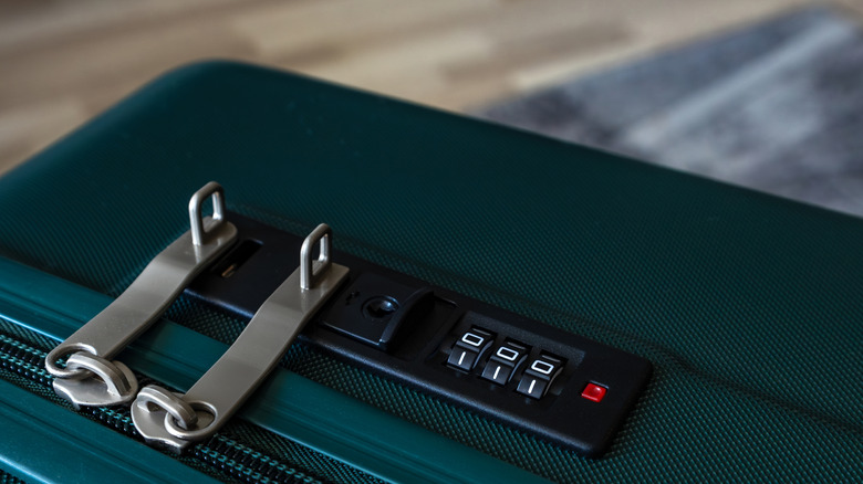 A combination lock on a suitcase