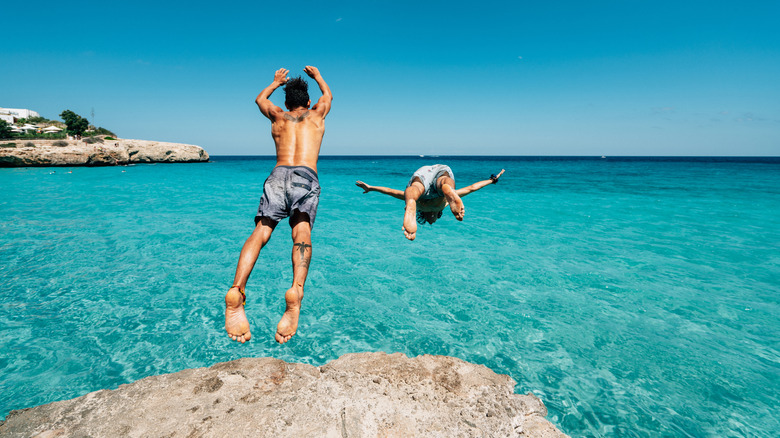 People diving into the ocean