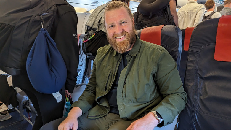 Writer ready to depart in travel outfit