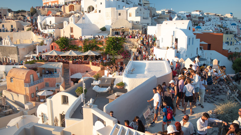 Buildings in Santorini packed with tourists.
