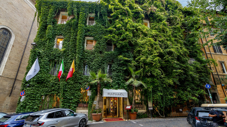 The Distinctive Exterior of Hotel Raphaël in Rome, covered in greenery