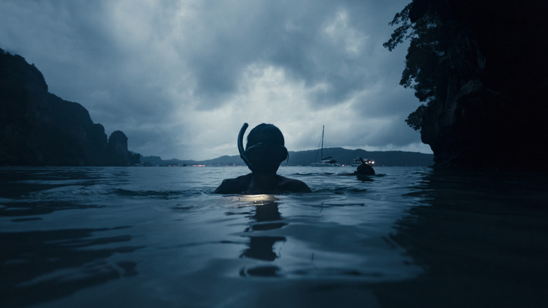 Young woman night snorkeling at Phi Phi Island Phuket, Thailand