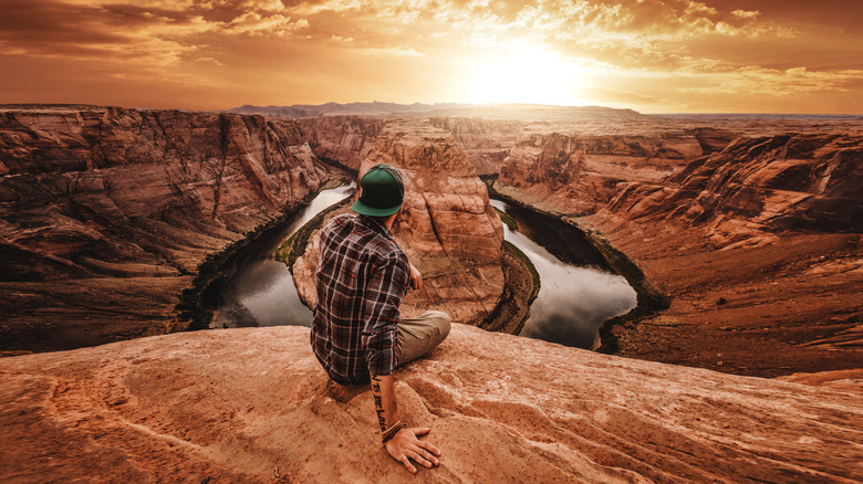 Tattooed traveler marveling the view at the Grand Canyon