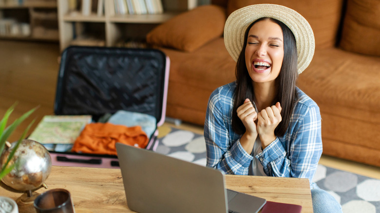Woman excited about booking flight