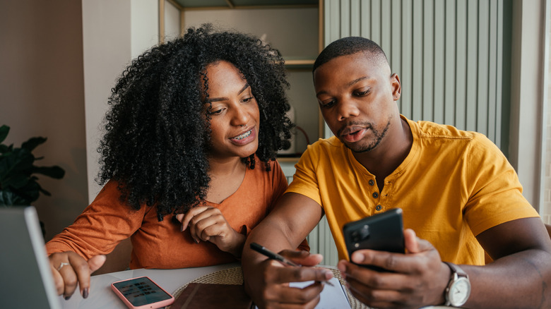 Couple planning a travel budget