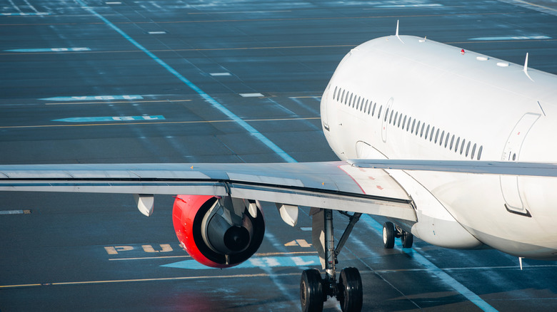 An airplane taxiing down the runway