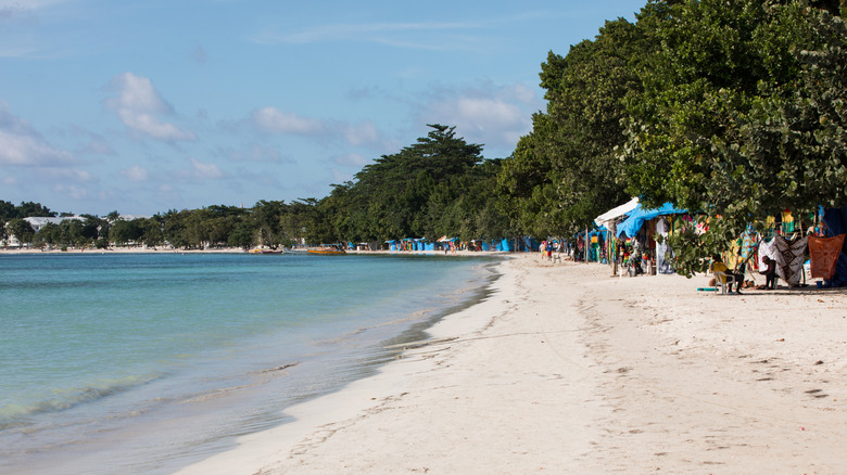 Seven Mile Beach, Negril with local huts and beachgoers