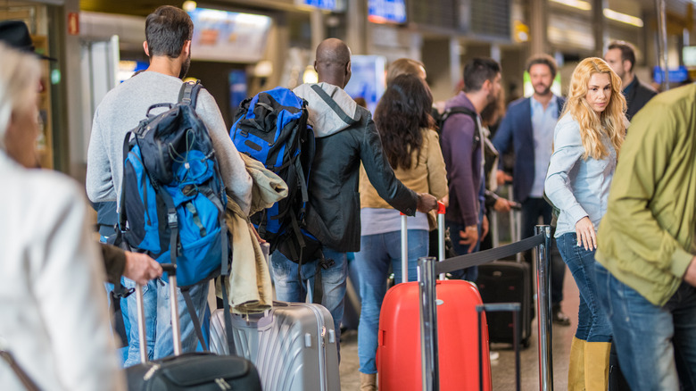 People standing in line at the airport