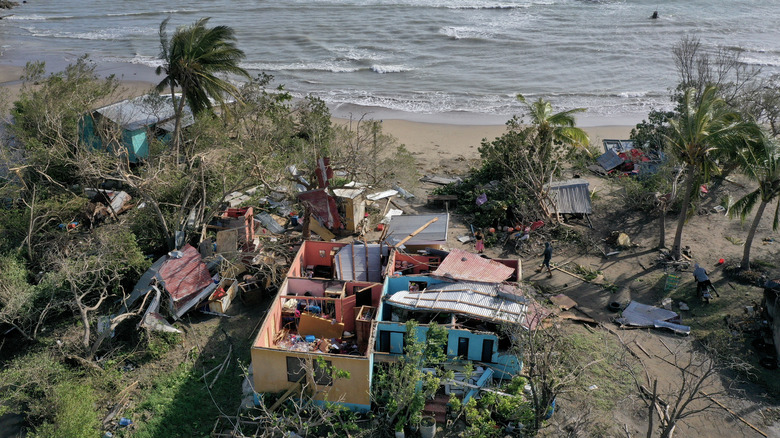 An aerial view of a Jamaican roof that blew off in Hurricane Beryl in 2024, just over a year before Melissa