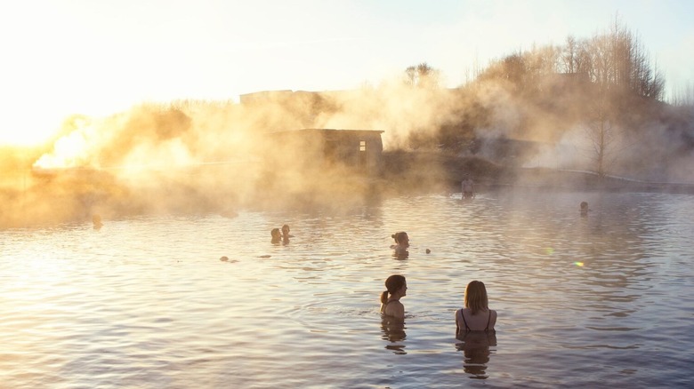 The Secret Lagoon, a geothermal area near Flúðir in Iceland, seen here at sunset