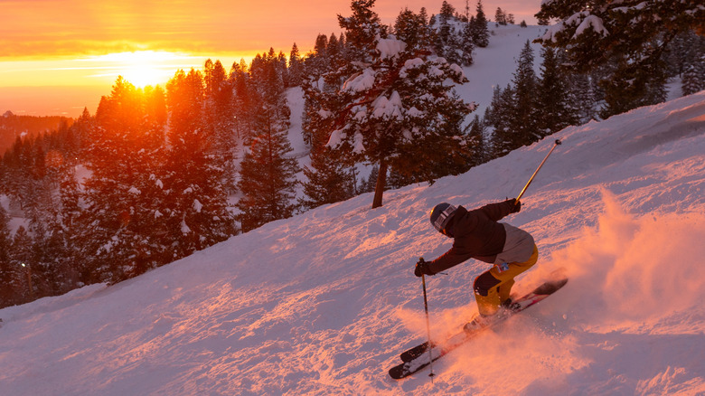 A person skiing at Bogus Basin Mountain Recreation Area at sunset