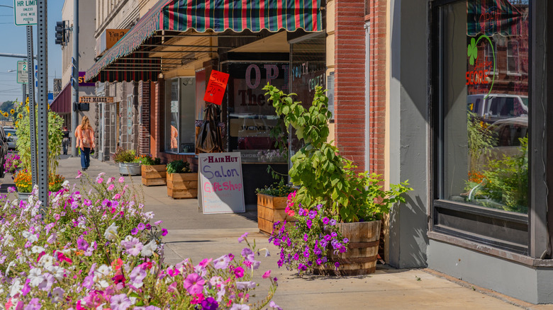 A downtown street in Pendleton, Oregon, with brick storefronts and flowers
